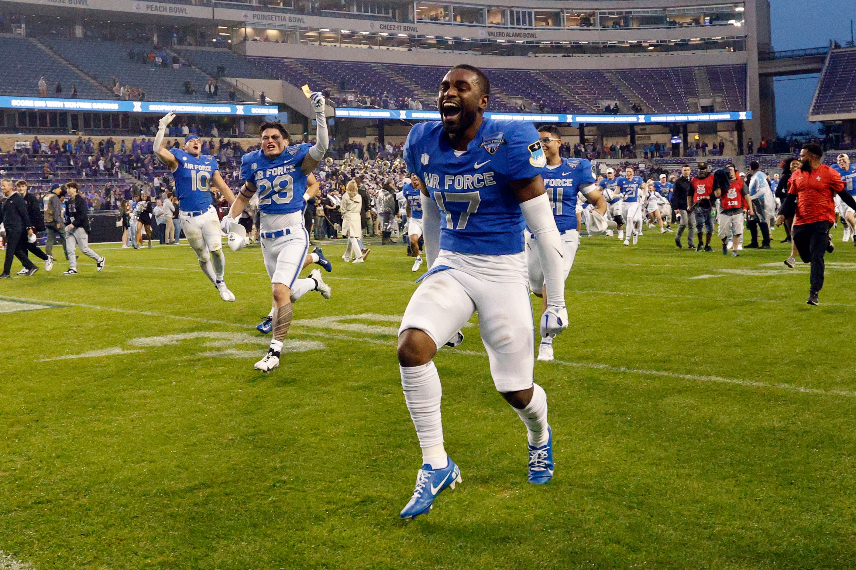 Air Force Falcons defensive back Zion Kelly (17) celebrates as he runs back to the sideline...