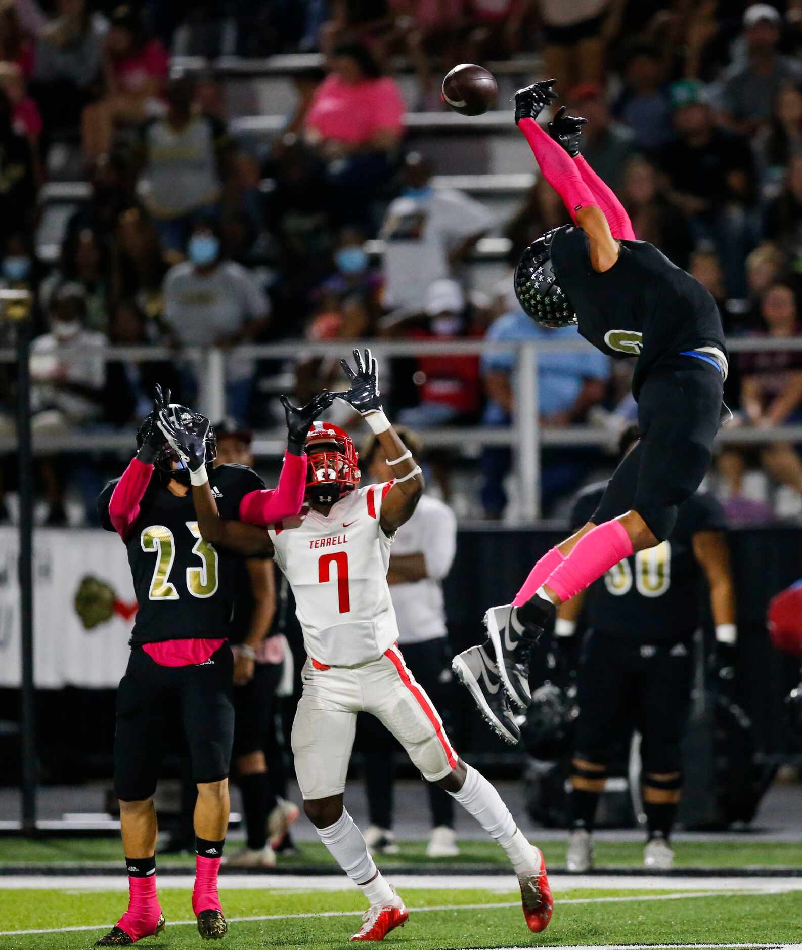 Kaufman senior wide receiver Daylon Dickerson, right, nearly intercepts a pass intended for...