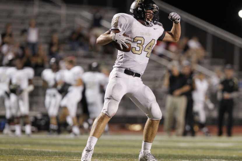 The Colony's Alec Gibbons (34) reacts after running for first down in the last minutes of a...