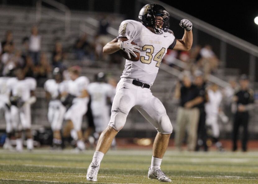 The Colony's Alec Gibbons (34) reacts after running for first down in the last minutes of a...