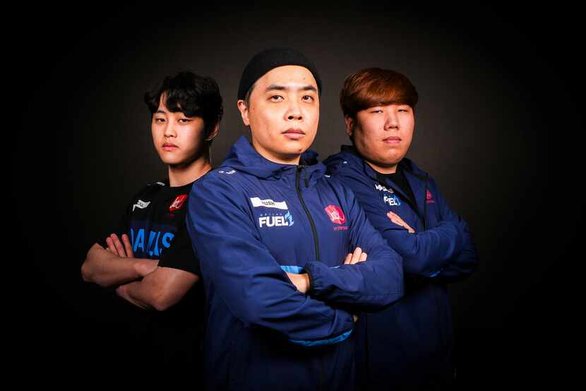 Dallas Fuel head coach Yun "RUSH" Hee-Won (center) photographed with assistant coaches Kim...