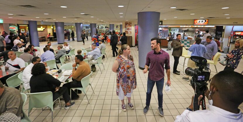 Brendan Meyer and Xan Alexander in the food court near Pacific Tower