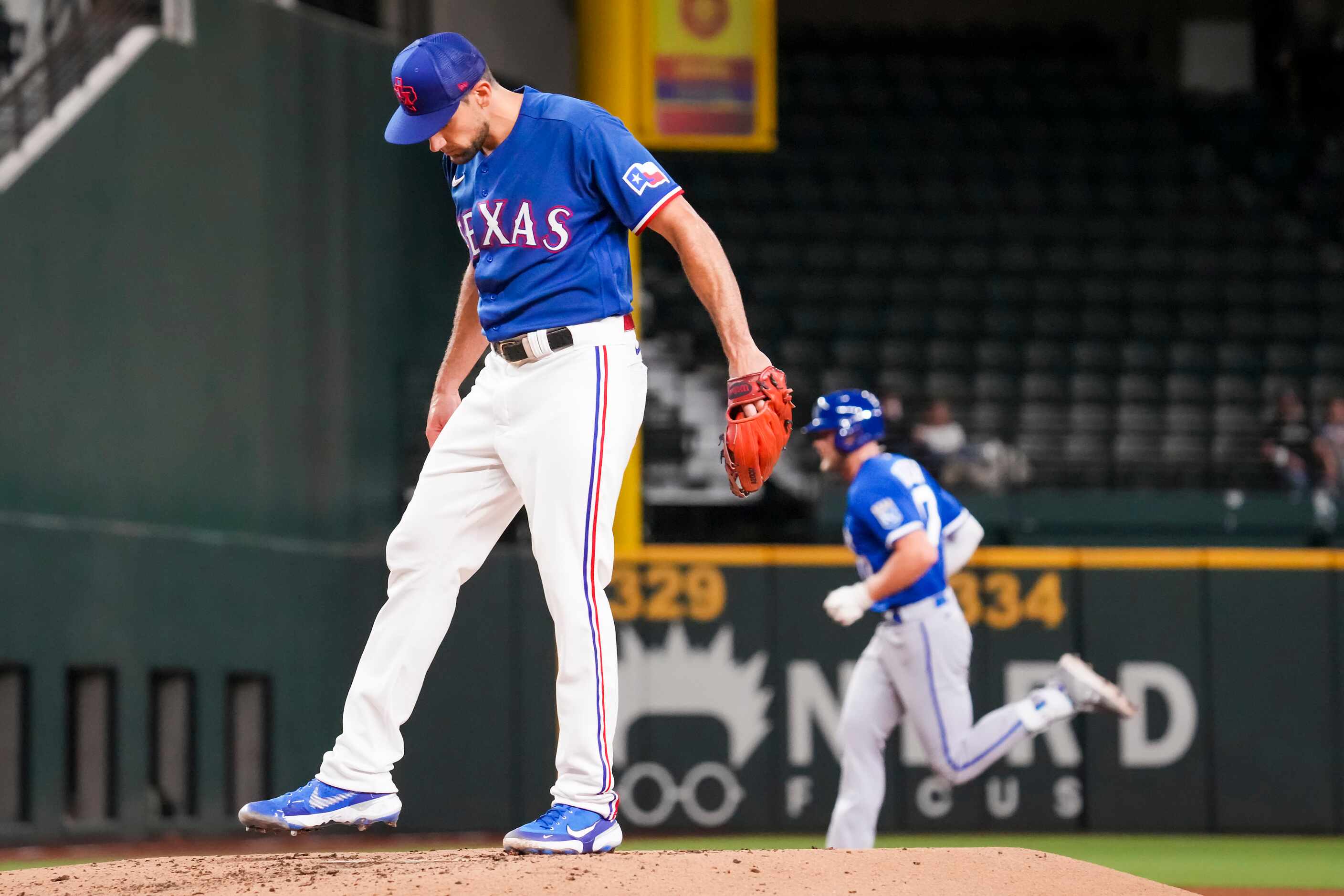 Texas Rangers starting pitcher Nathan Eovaldi (17) reacts as Kansas City Royals third...