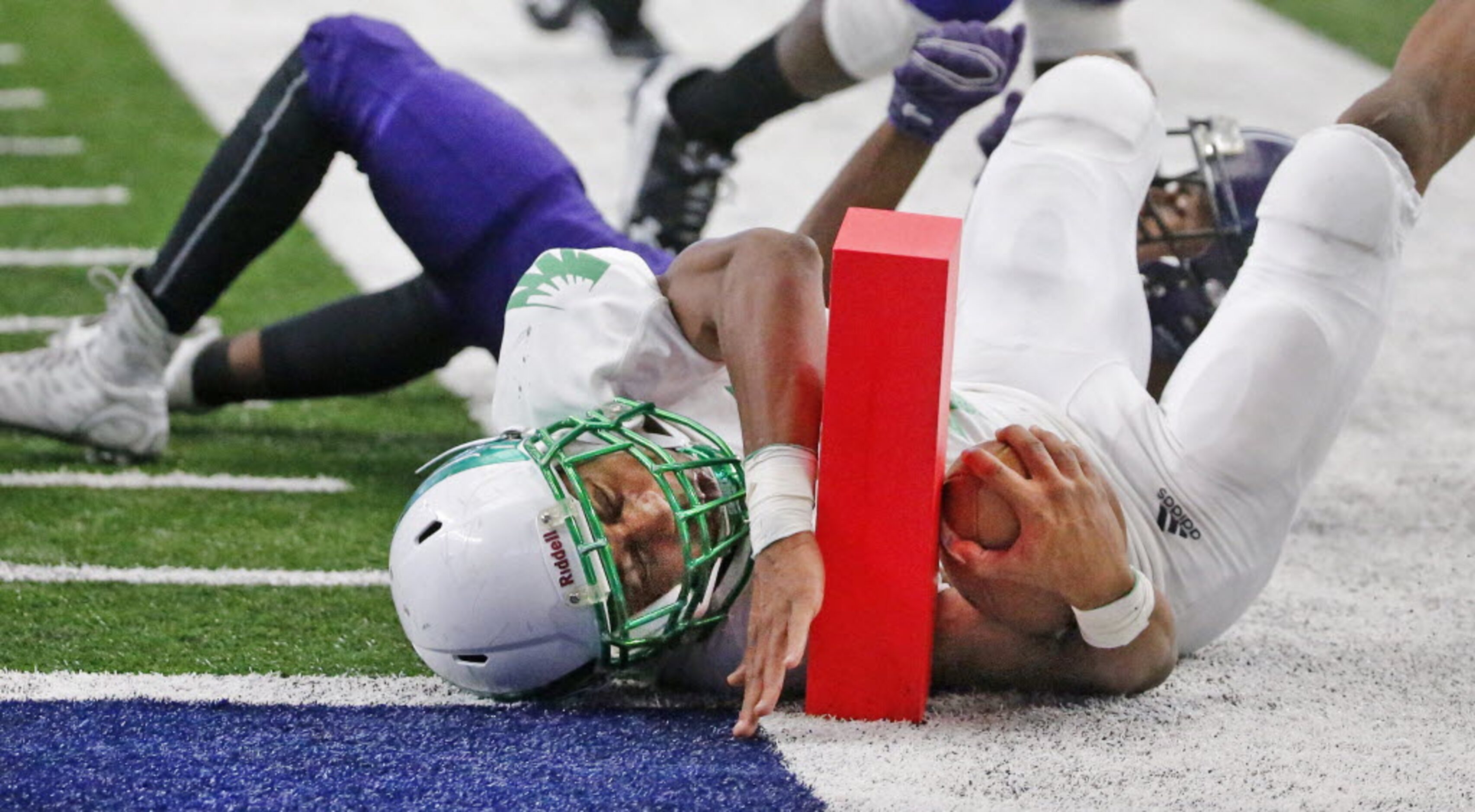 Lake Dallas running back Courtenay Holder (14) comes up just short of the pylon on a fourth...