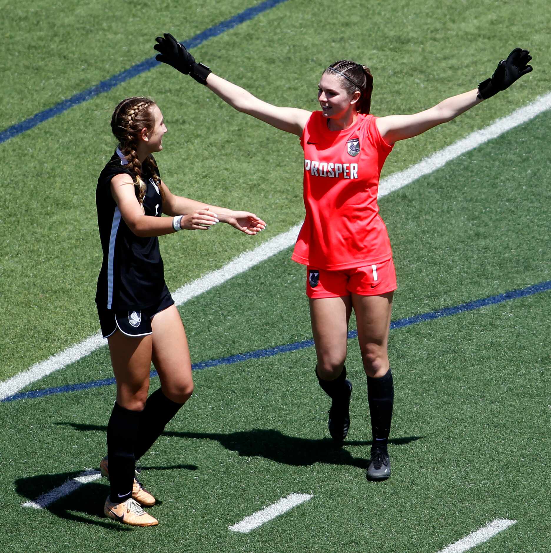 Prosper goalkeeper Maggie Manning (1), right, celebrates with teammate Rhiannon Mahon (5)...