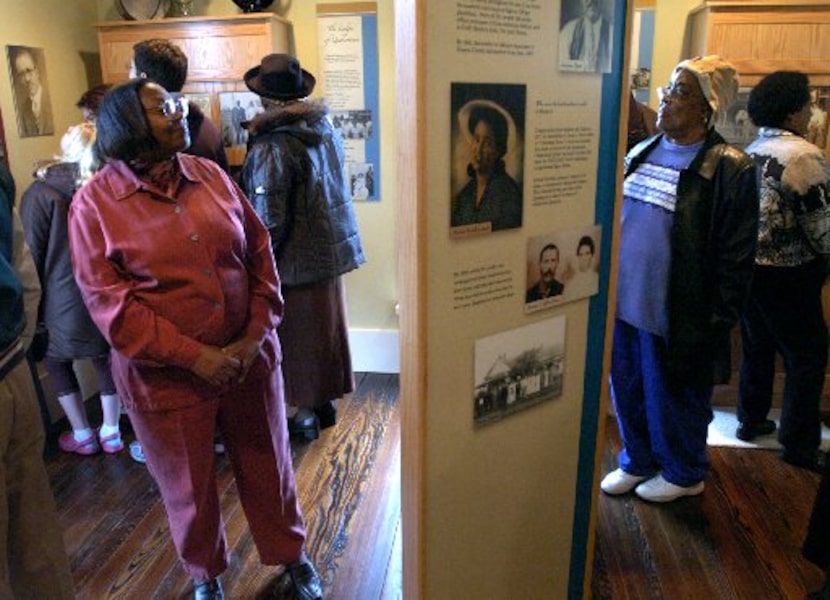 Hester Wood of Abilene (left) and Fran Morgan of Denton look at exhibits on display at the...