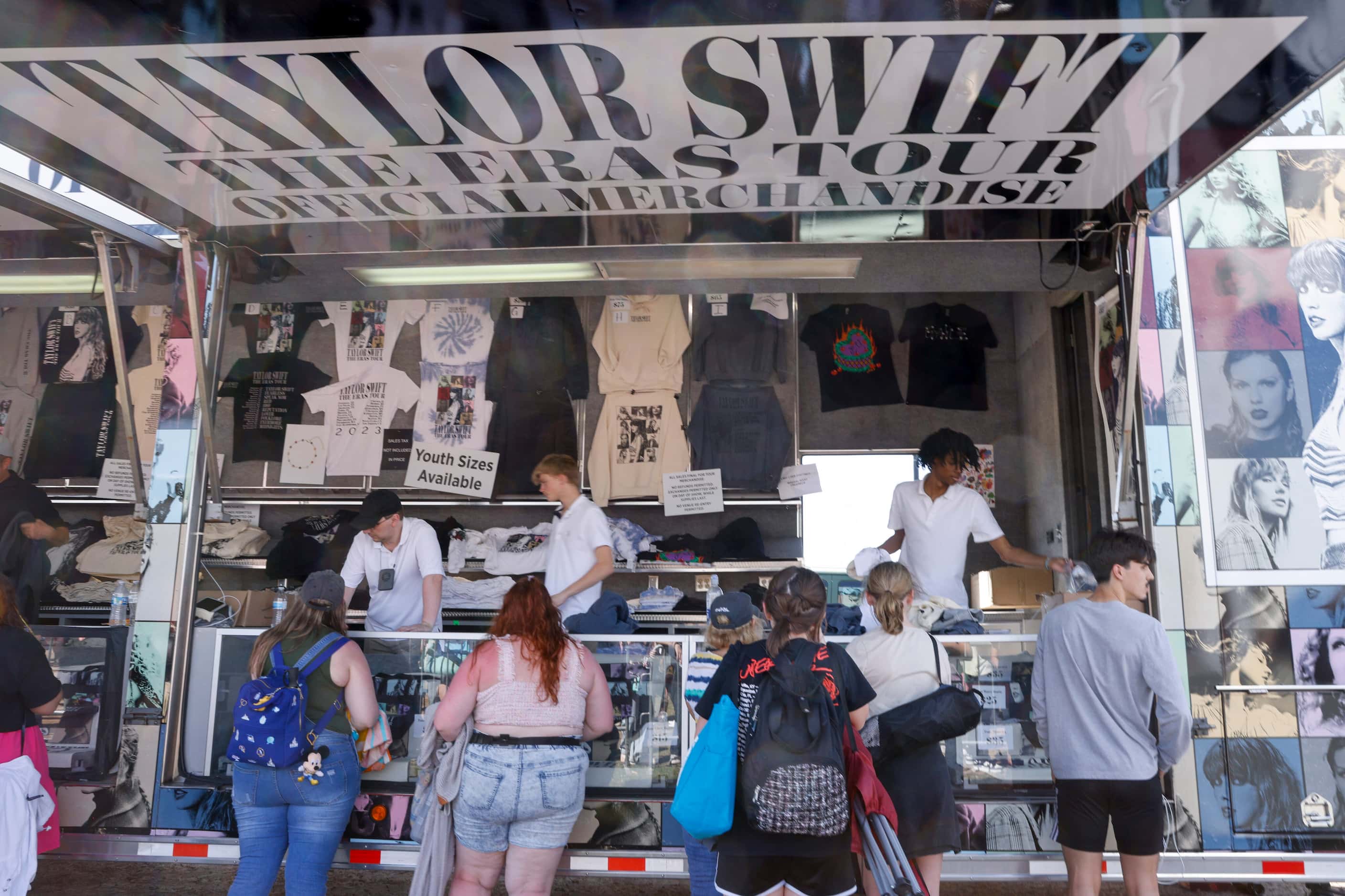 Fans buy Taylor Swift merchandise before a Taylor Swift Eras Tour concert at AT&T Stadium.