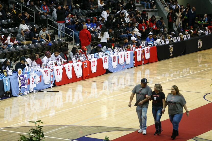 Players take their seats during a Dallas ISD signing day event at Ellis Davis Field House on...