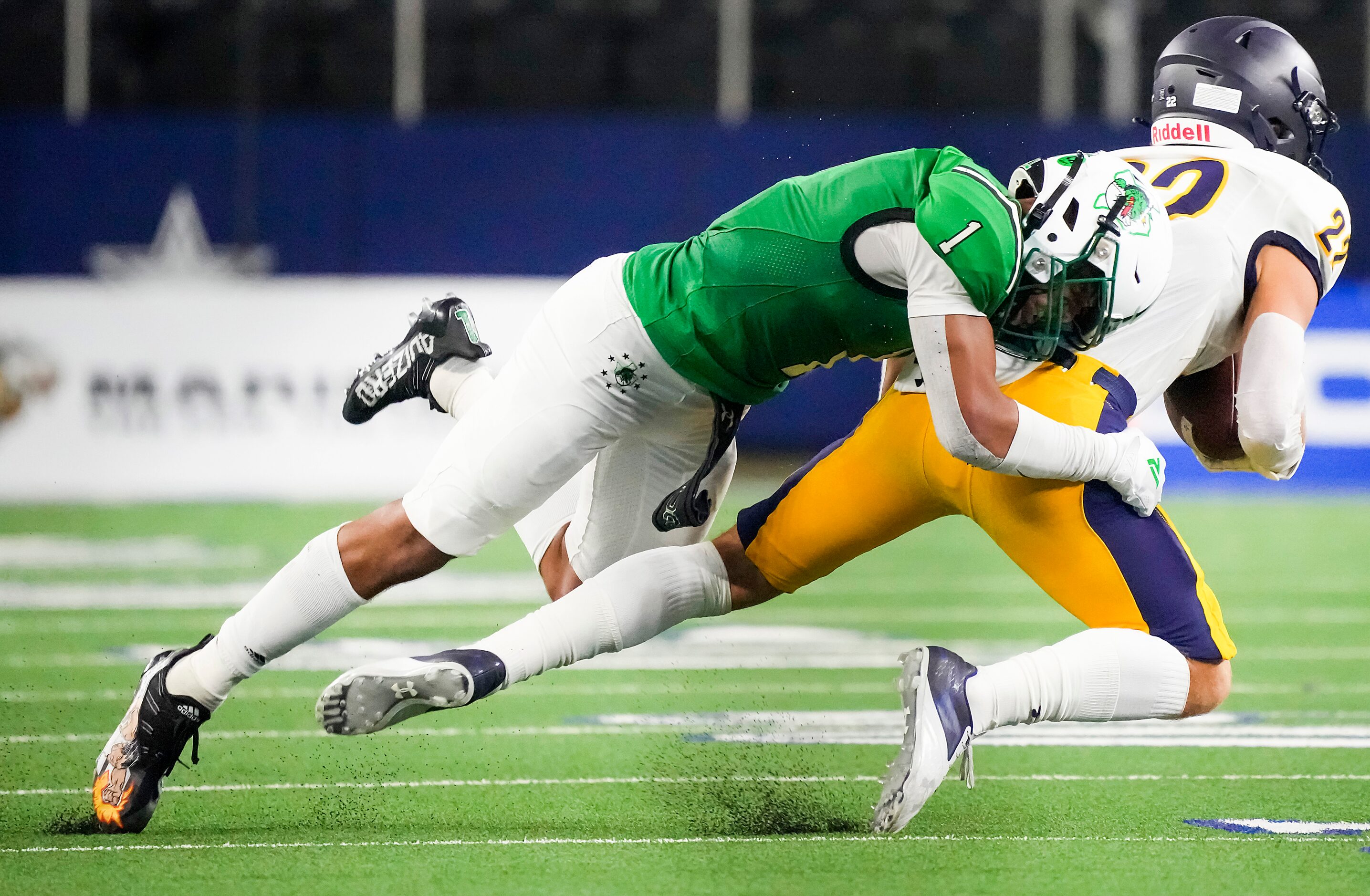 Southlake Carroll defensive back Avyonne Jones (1) brings down Highland Park’s Luke Rossley...