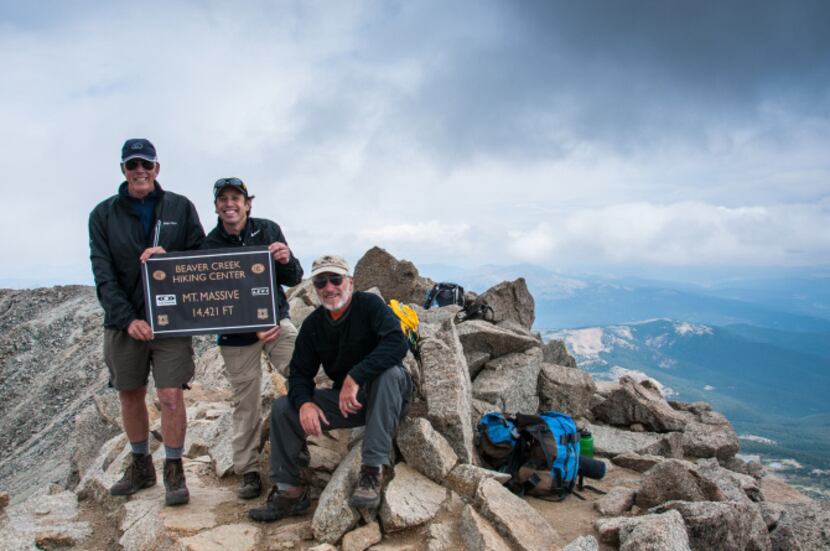 A group of Beaver Creek climbers rest on the summit of Mount Massive, Colorado's second...