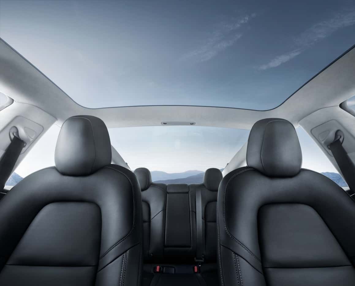 The Tesla Model 3's glass roof gives the interior an airy feel.