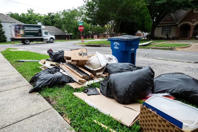 Bulk trash is near a curb on Prospect Avenue and Skillman Street in Dallas, on June 08, 2021.