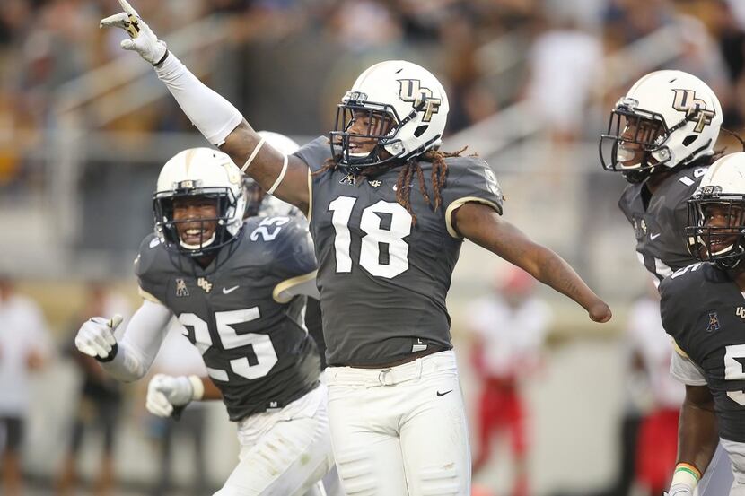 UCF linebacker Shaquem Griffin (18) celebrates after returning a fumble 20 yards for a...