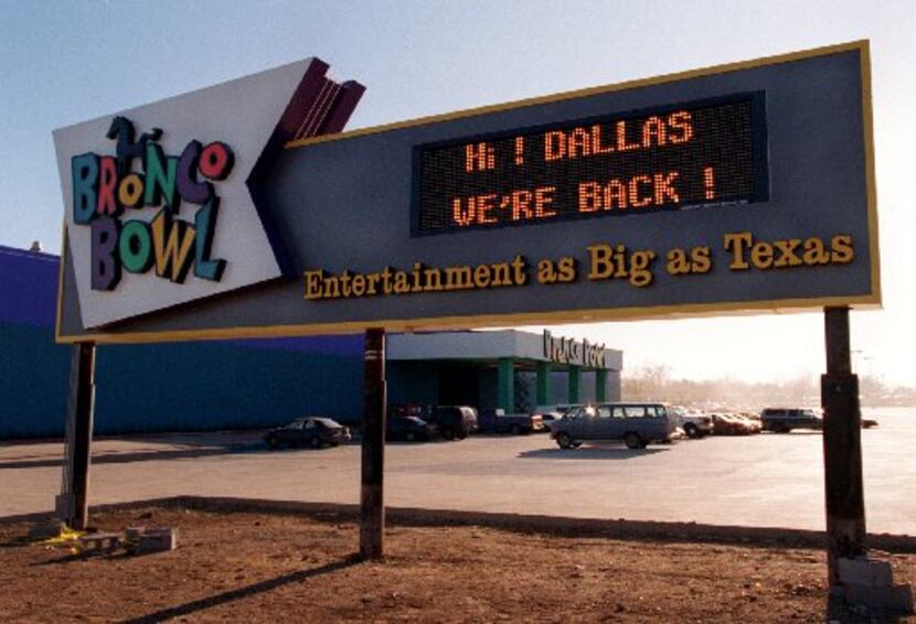 A sign at the Bronco Bowl at 2600  Fort Worth Ave. brags about the reopening going on. The...