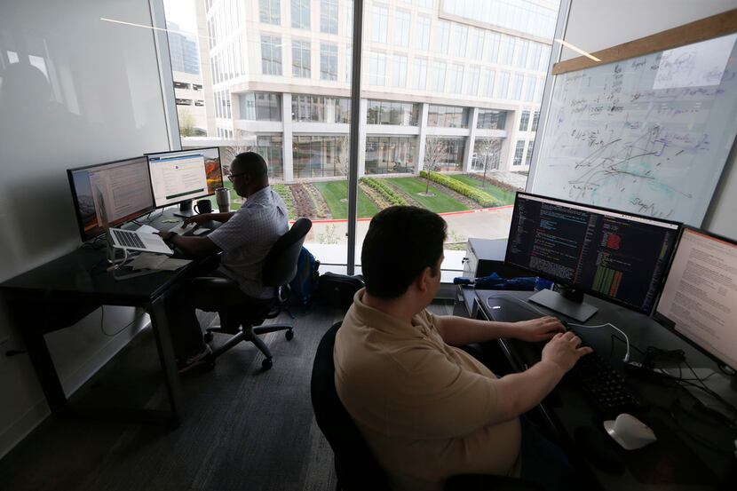 Michael Mugo (left) and Kyle Marple work at Walmart Tech DFW at Common Desk in Plano on...