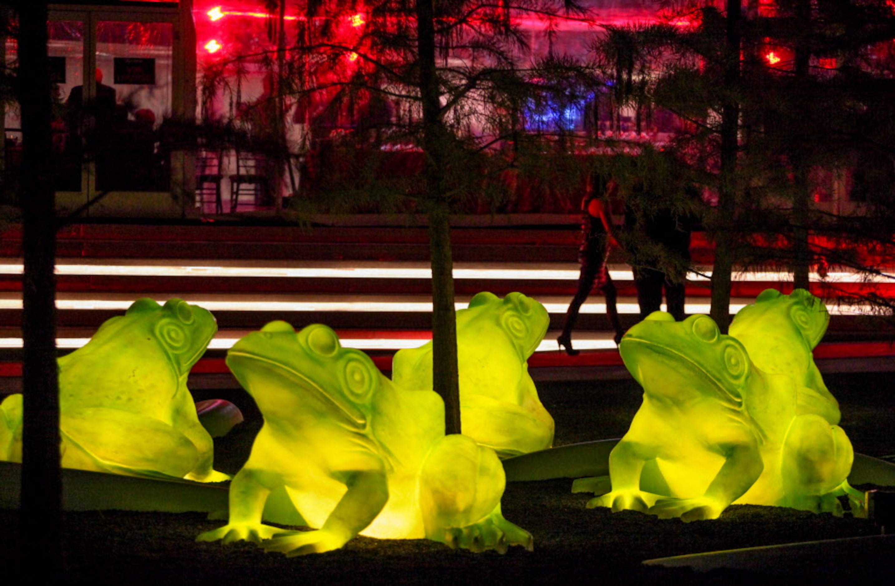 Giant illuminated leap frogs on the one-acre science park outside the west entry of the...