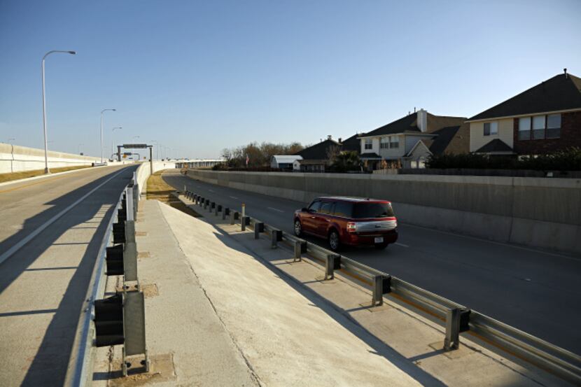 While the tollway’s access roads have 8-foot-high sound walls, Rowlett residents say the...