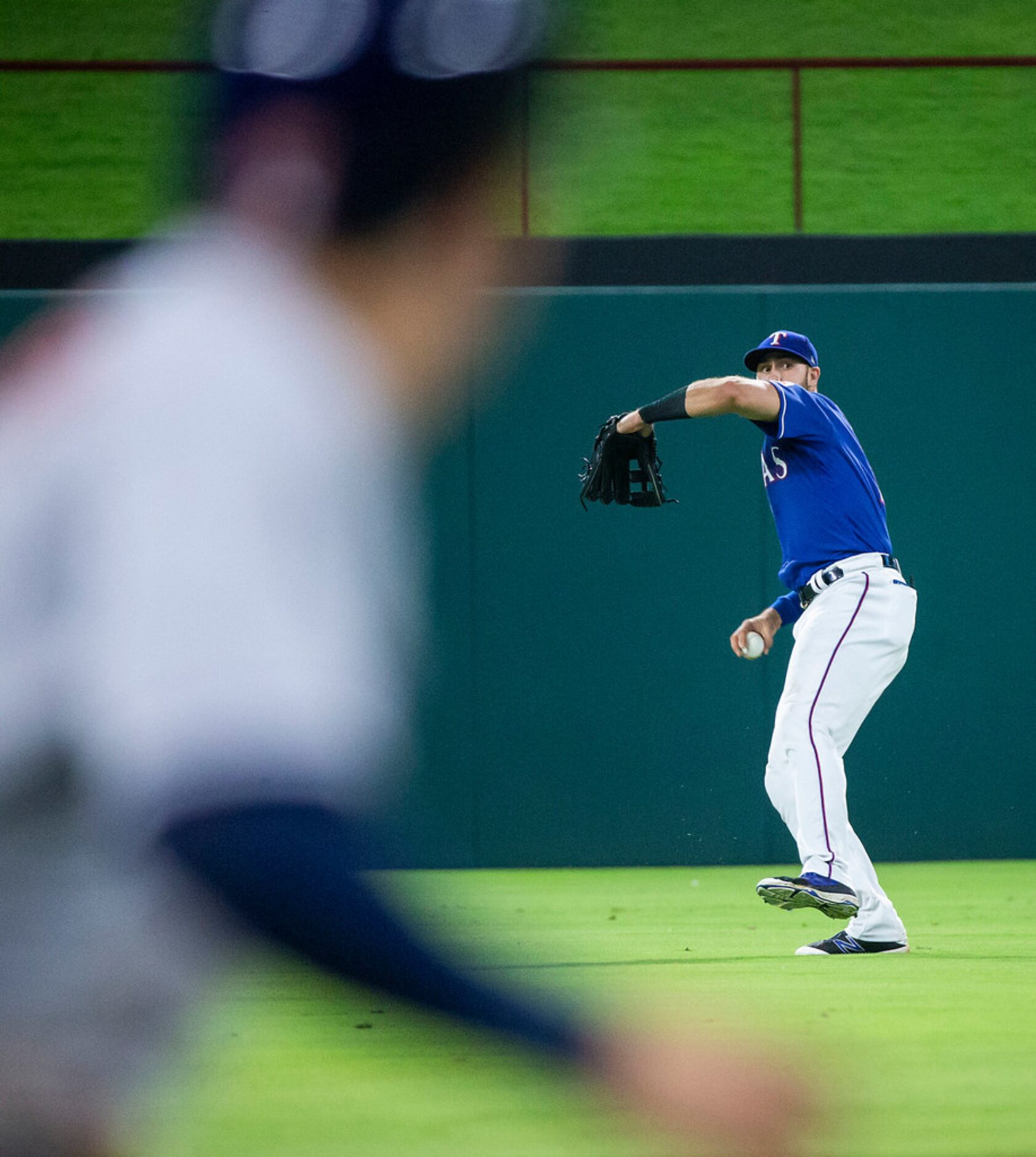 Texas Rangers infielder Joey Gallo makes a throw as Houston Astros second baseman Jose...