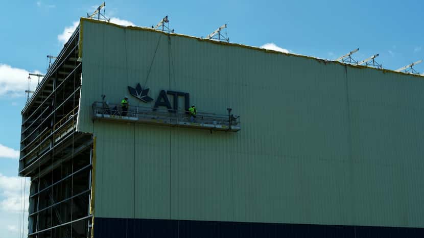 A sign is installed on ATI's 200-foot tower in Vandergrift, Pa., part of the upgrade to the...