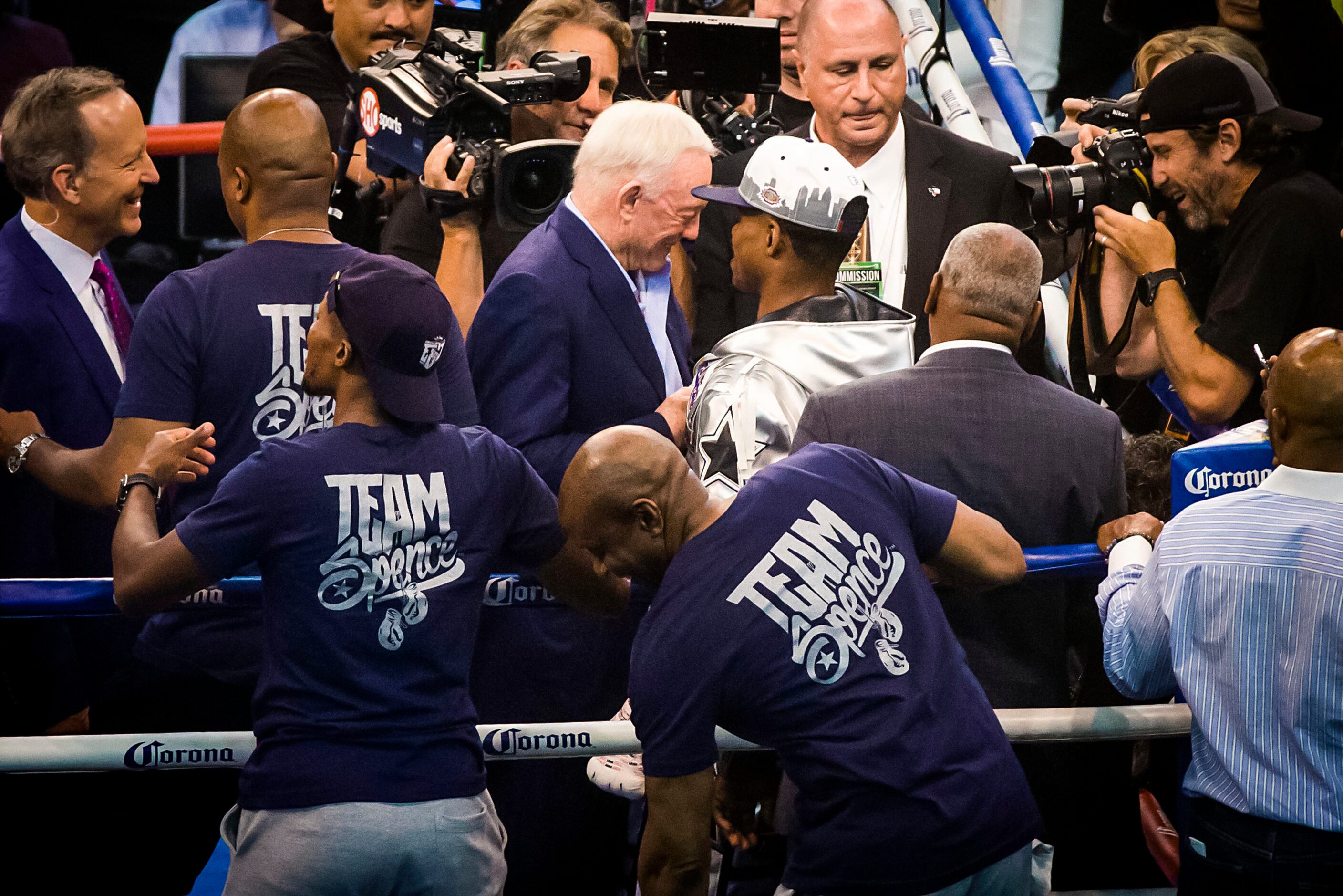 Dallas Cowboys owner Jerry Jones congratulates welterweight champion Errol Spence Jr. after...