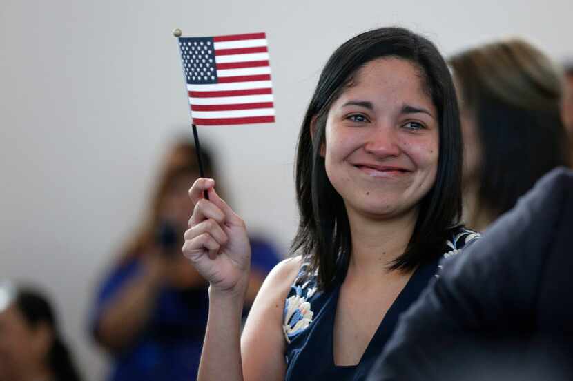 Julieta Chiquillo tears up after taking the Oath of Allegiance for her U.S. citizenship on...