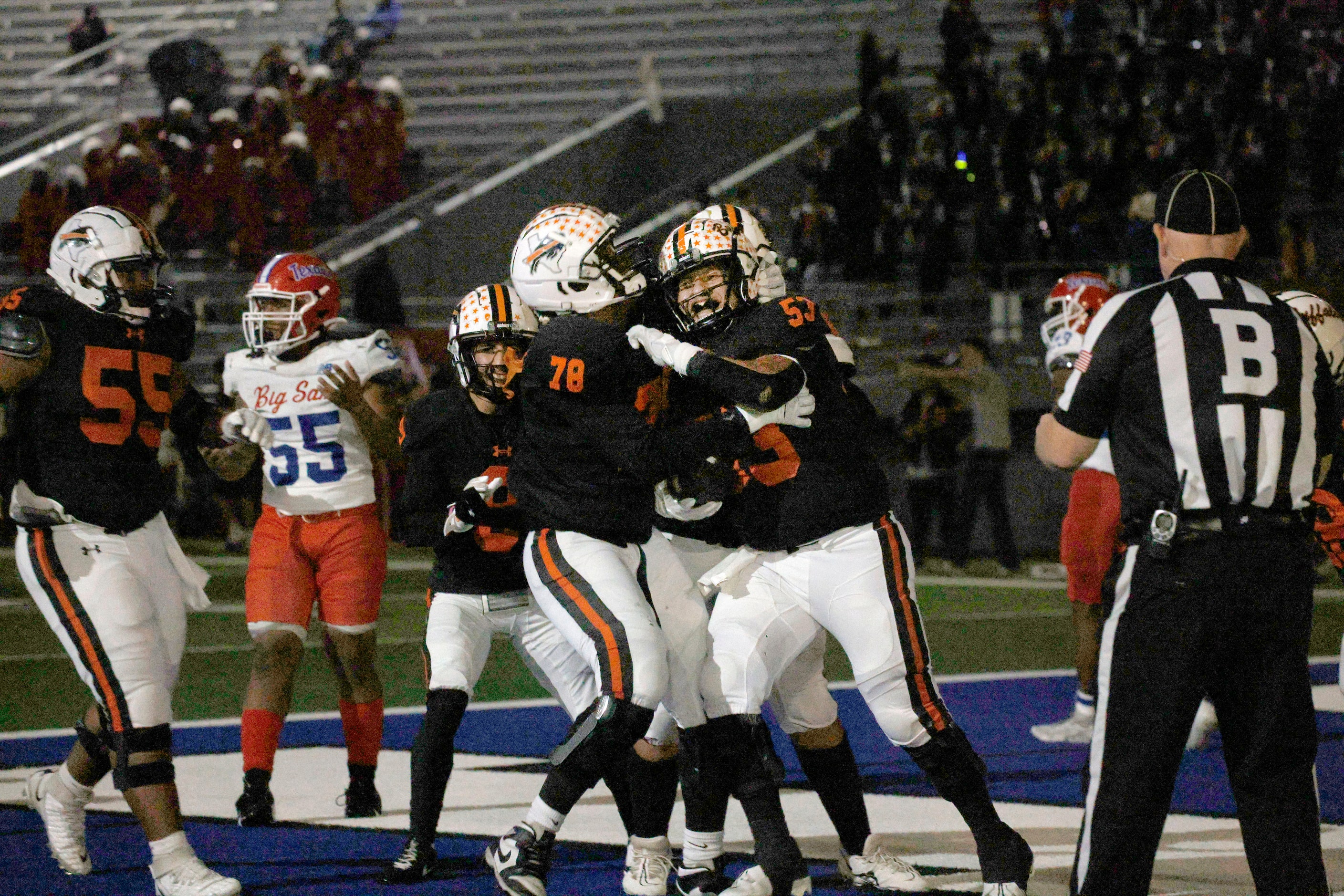 Haltom's Angel Padilla (53) celebrates with his teammates after scoring a touchdown in the...