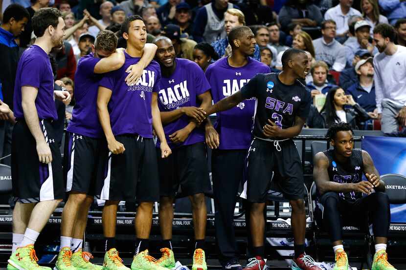 PORTLAND, OR - MARCH 19: The Stephen F. Austin Lumberjacks bench reacts in the second half...