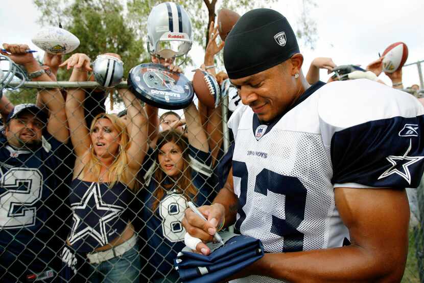 FILE - In this July 31, 2006, file photo, Dallas Cowboys wide receiver Terry Glenn signs...