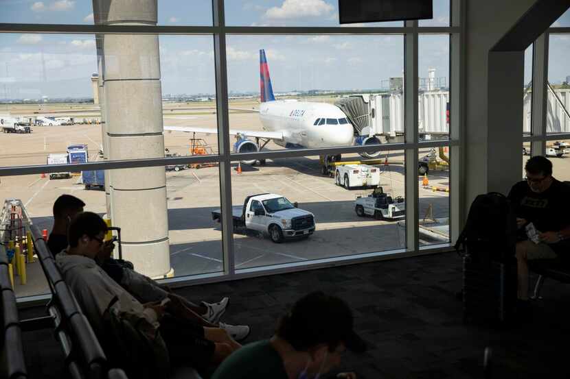 A Delta Airlines plane sits at Terminal E at Dallas/Fort Worth International Airport on July...