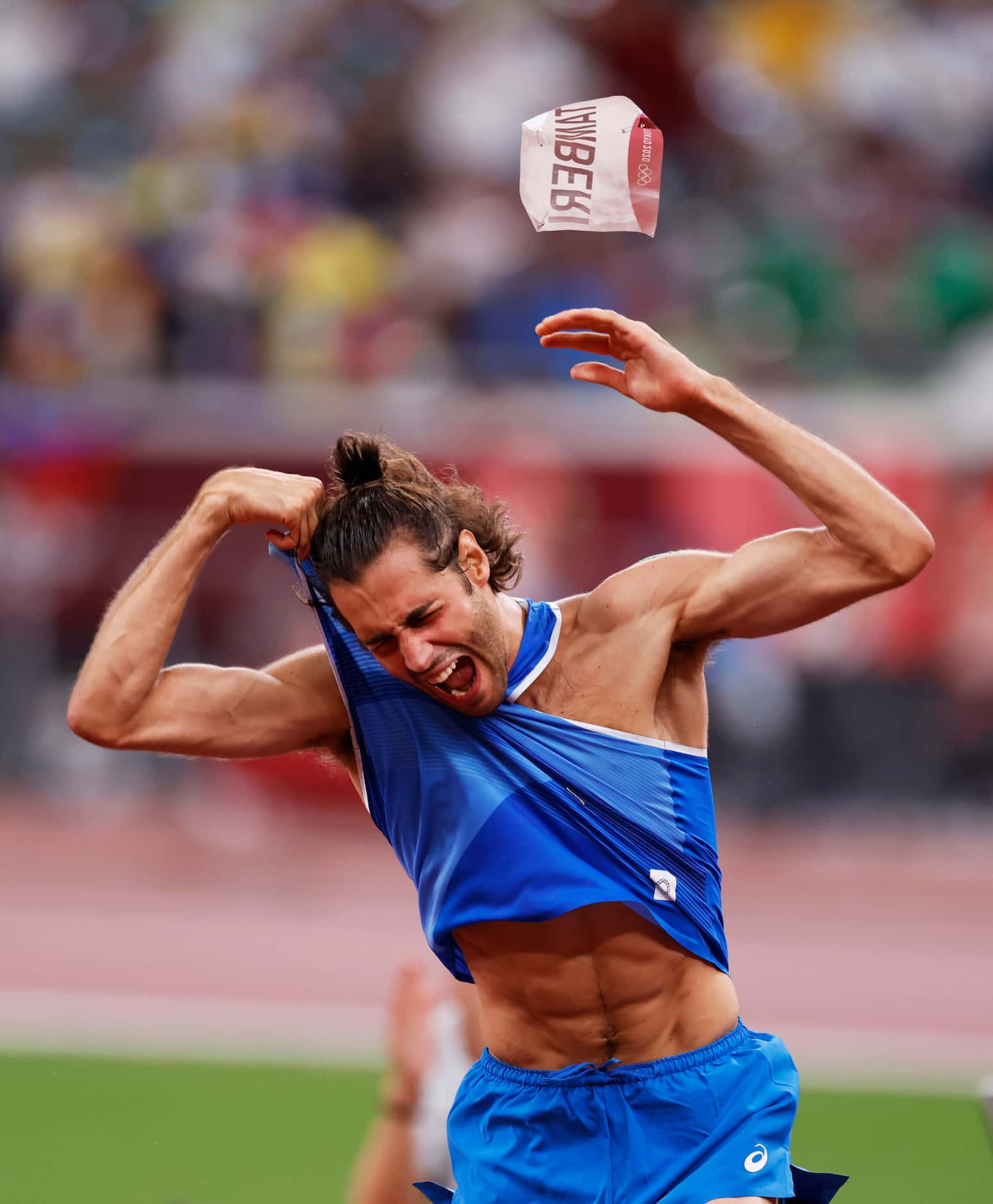 Italy’s Gianmarco Tamberi celebrates after winning a gold medal in the men’s high jump final...