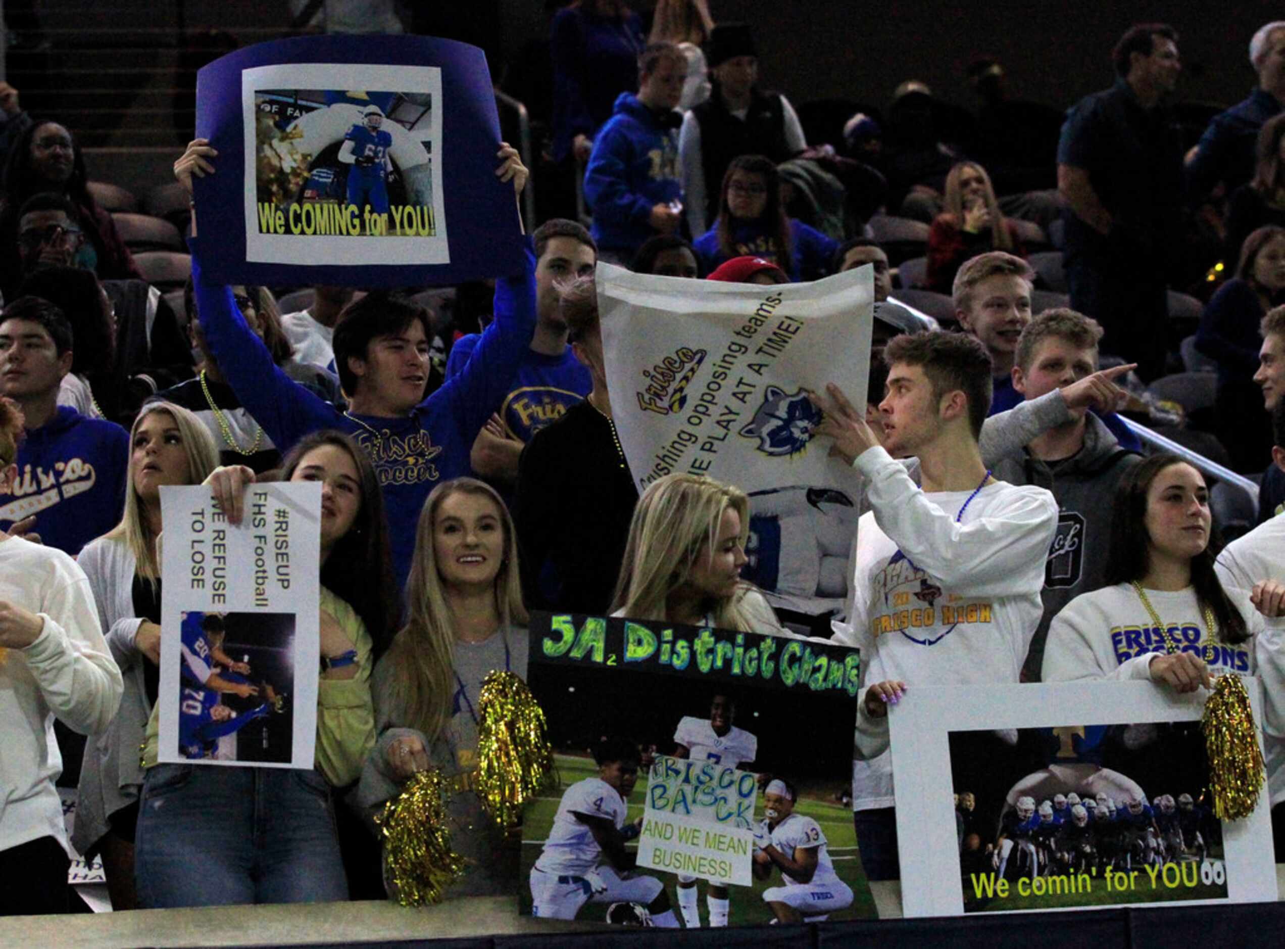 Frisco fans hold up signs during the first half of the team's game against South Oak Cliff...