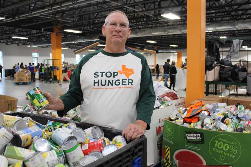 A North Texas Food Bank (NTFB) volunteer gathers food donations for distribution across...