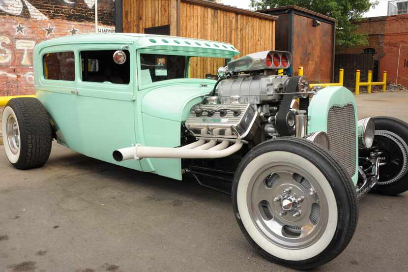 This 1929 Ford Sedan features custom paint and is on display at the Invasion Car Show in...