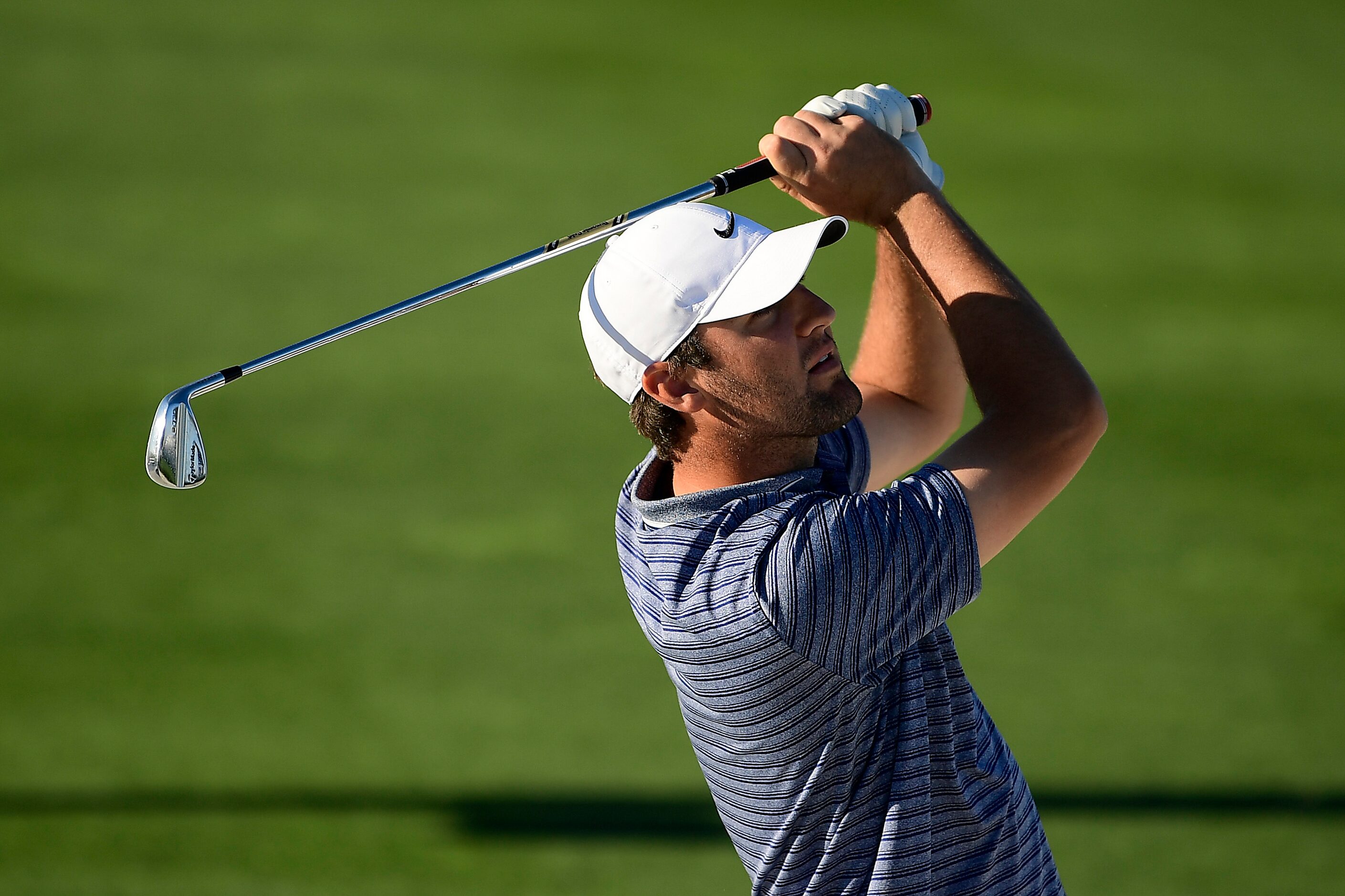 SCOTTSDALE, ARIZONA - JANUARY 30:  Scottie Scheffler plays his shot on the ninth hole during...