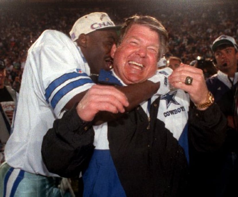 Cowboys coach Jimmy  Johnson gets a big hug from wide reciever Michael Irvin following ...