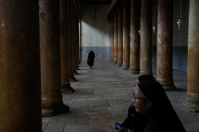 A worshipper walks through the Church of the Nativity, traditionally believed to be the...