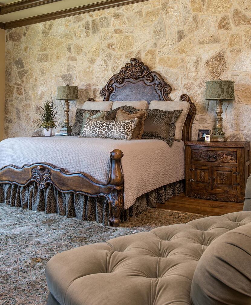 From left:  A carved bed  in the master bedroom is flanked by reclaimed wood nightstands...