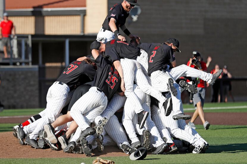 Texas Tech players celebrate after an NCAA college baseball tournament super regional game...