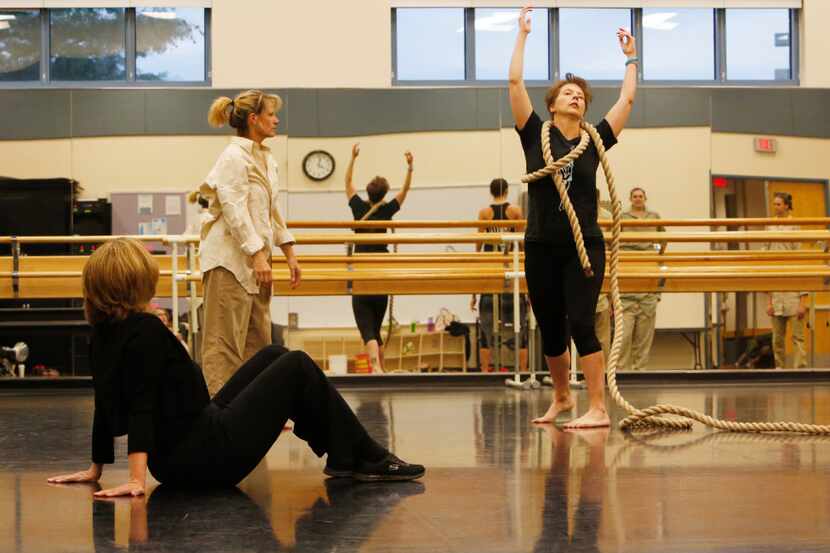 Elledanceworks dance company co-founder Michele Hanlon, seated, watches rehearsal at Collin...