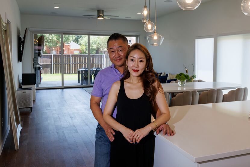 Hawk Jung (left) and his wife Ji Jung are shown inside their home in Frisco.