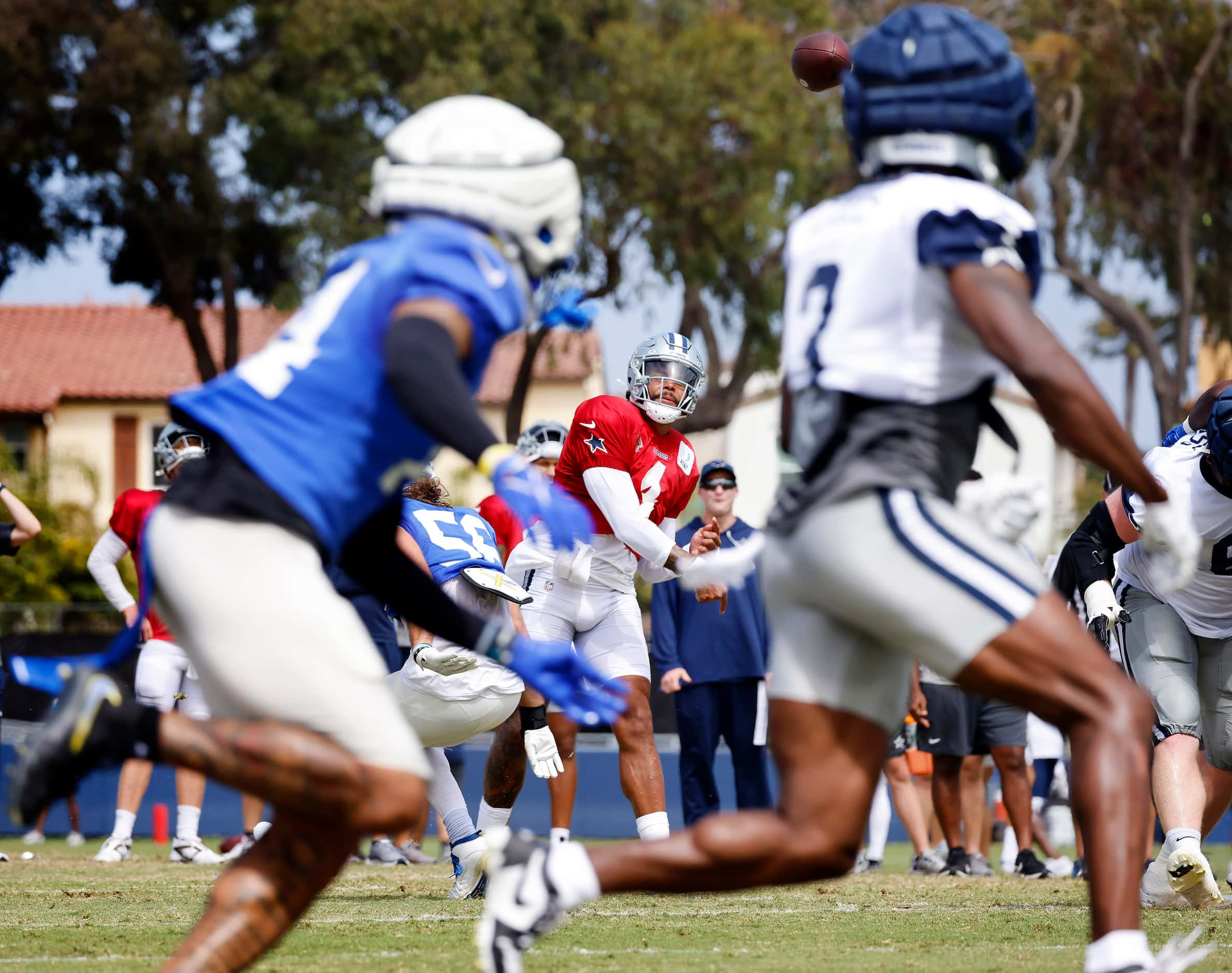 Dallas Cowboys quarterback Dak Prescott (4) fires a red zone pass to wide receiver Brandin...