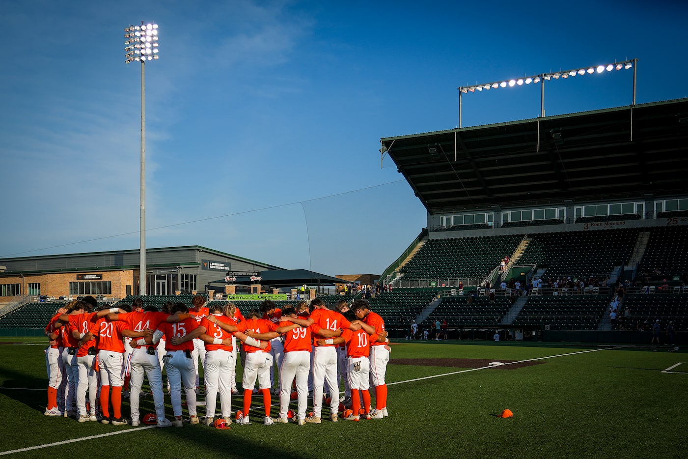 Celina players huddle in the outfield after a loss to Sinton in a UIL 4A baseball state...