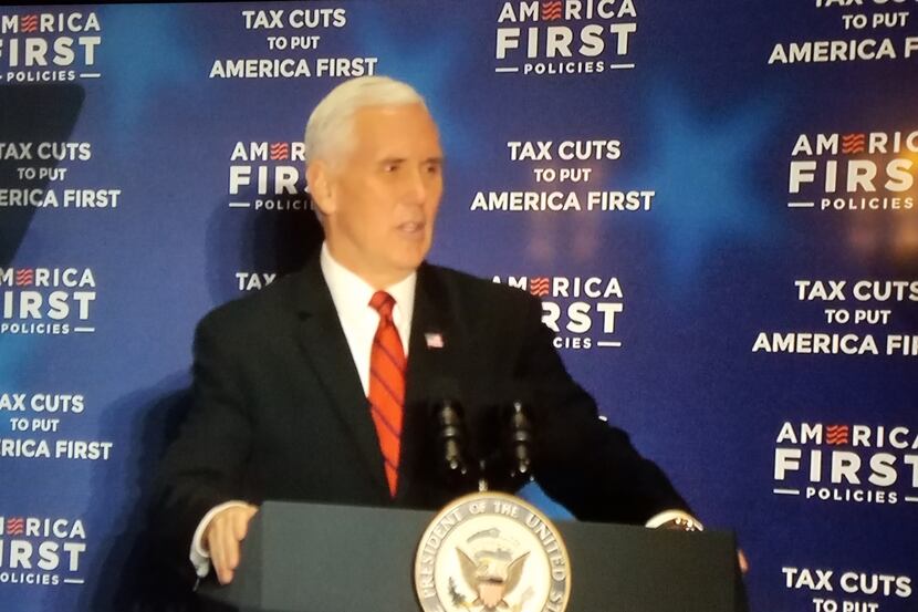 Vice President Mike Pence appears on a TV screen at the Dallas Sheraton on Feb. 17, 2018,...