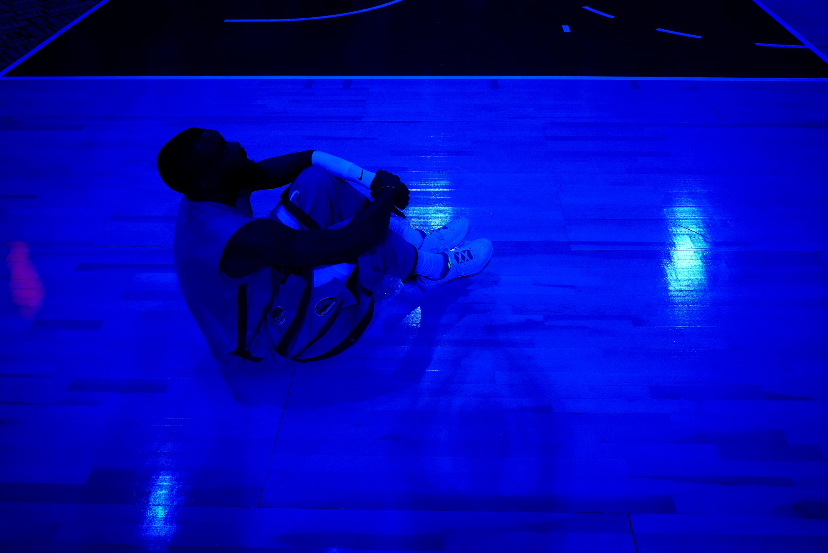 Dallas Mavericks forward Tim Hardaway Jr. watches a pregame video before an NBA basketball...