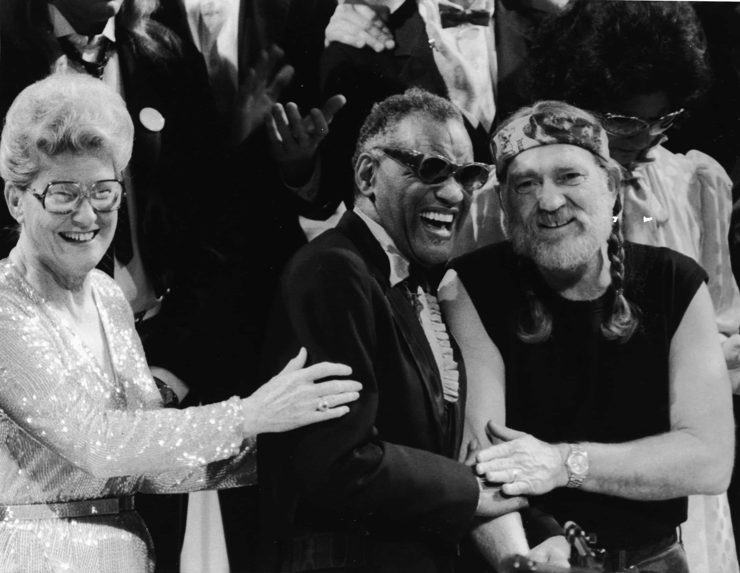 1980 - American musicians Minnie Pearl, Ray Charles and Willie Nelson laugh together.