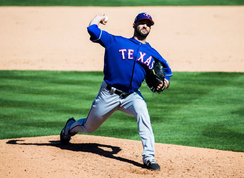 Texas Rangers starting pitcher Dillon Gee (36) pitches during the fourth inning of a spring...