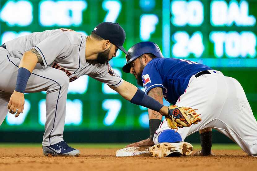 Texas Rangers second baseman Rougned Odor is out at second base as Houston Astros shortstop...