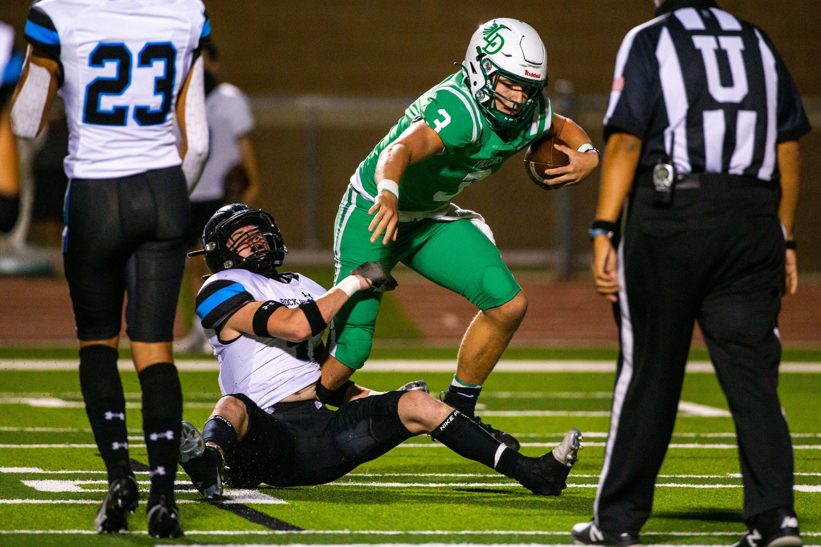 Rock Hill defensive back Coleman Weaver (4) fails to bring down Lake Dallas quarterback...