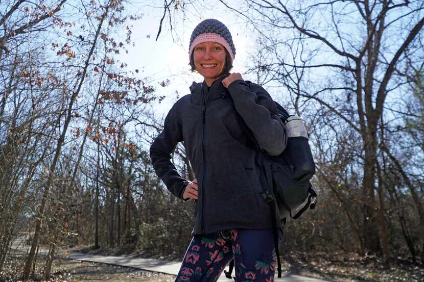Shannon Catalano gets in an eight-mile walk on The Trail at the Woods in Allen, part of the...