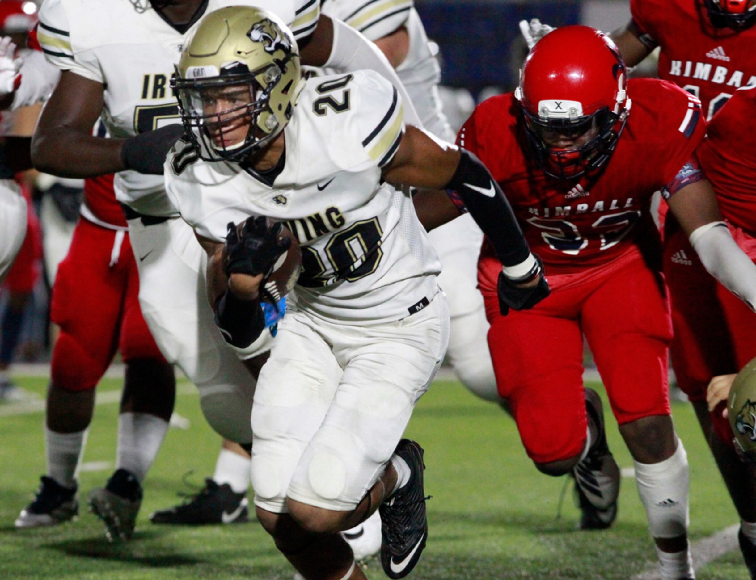Irving High RB Nikolas Cole (20) picks up a couple of yards during the first half of their...